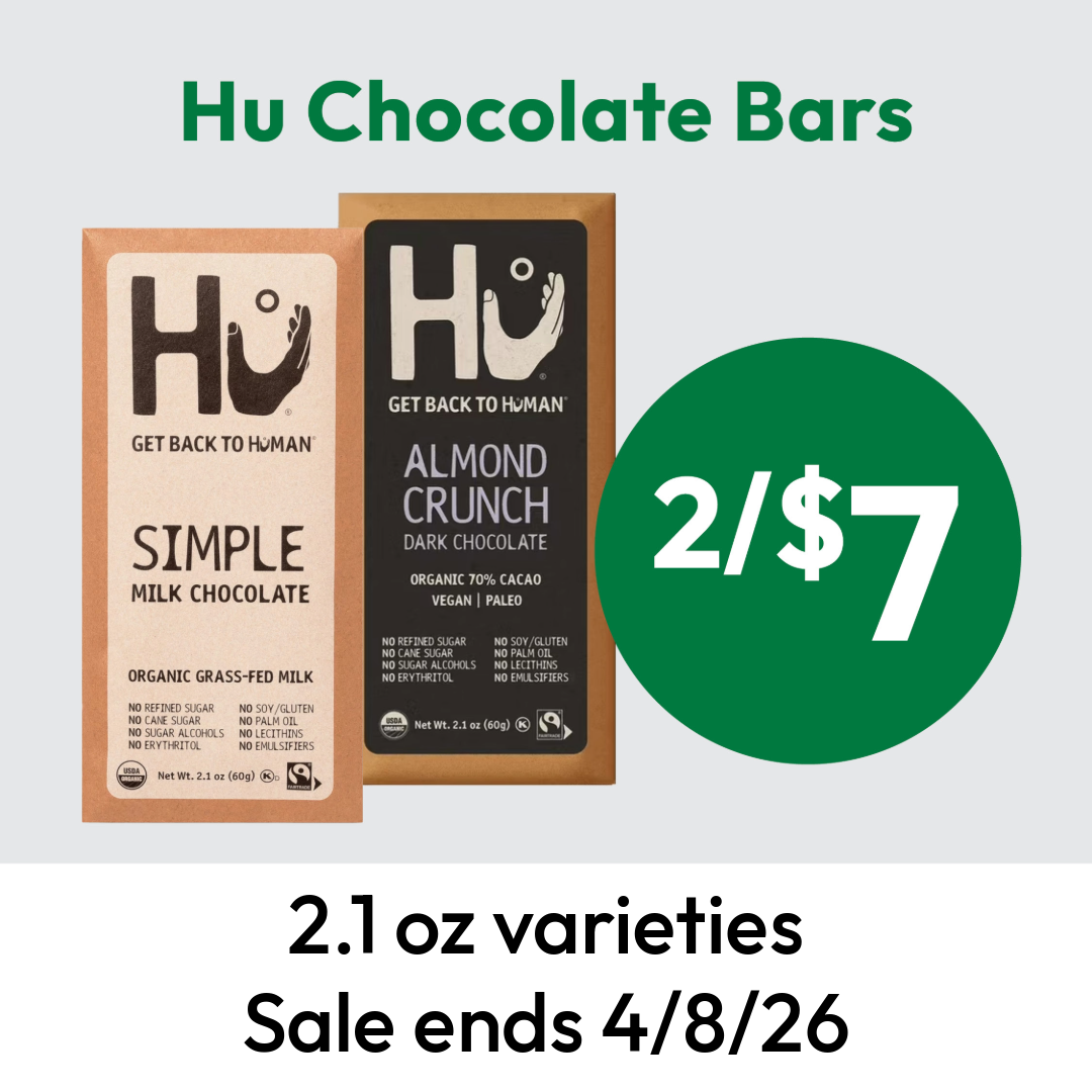 Two Hu chocolate bars, Simple Milk Chocolate and Almond Crunch, are shown with a green circle reading “2/$7.” Text below states, “2.1 oz varieties. Sale ends 4/8/26.”.