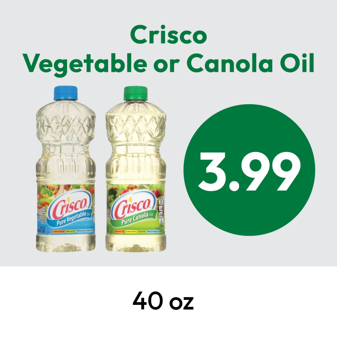 Two bottles of Crisco oil, one vegetable and one canola, with a price of $3.99 displayed in a green circle. The bottles are 40 oz each. Text above reads Crisco Vegetable or Canola Oil.
