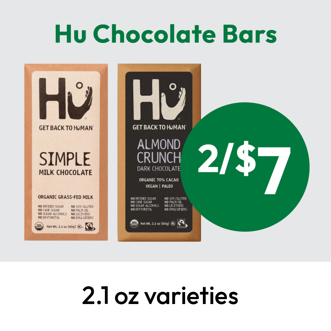 Two Hu Chocolate bars, one Simple Milk Chocolate and one Almond Crunch Dark Chocolate, with text 2/$7 in a green circle. Caption below reads 2.1 oz varieties.