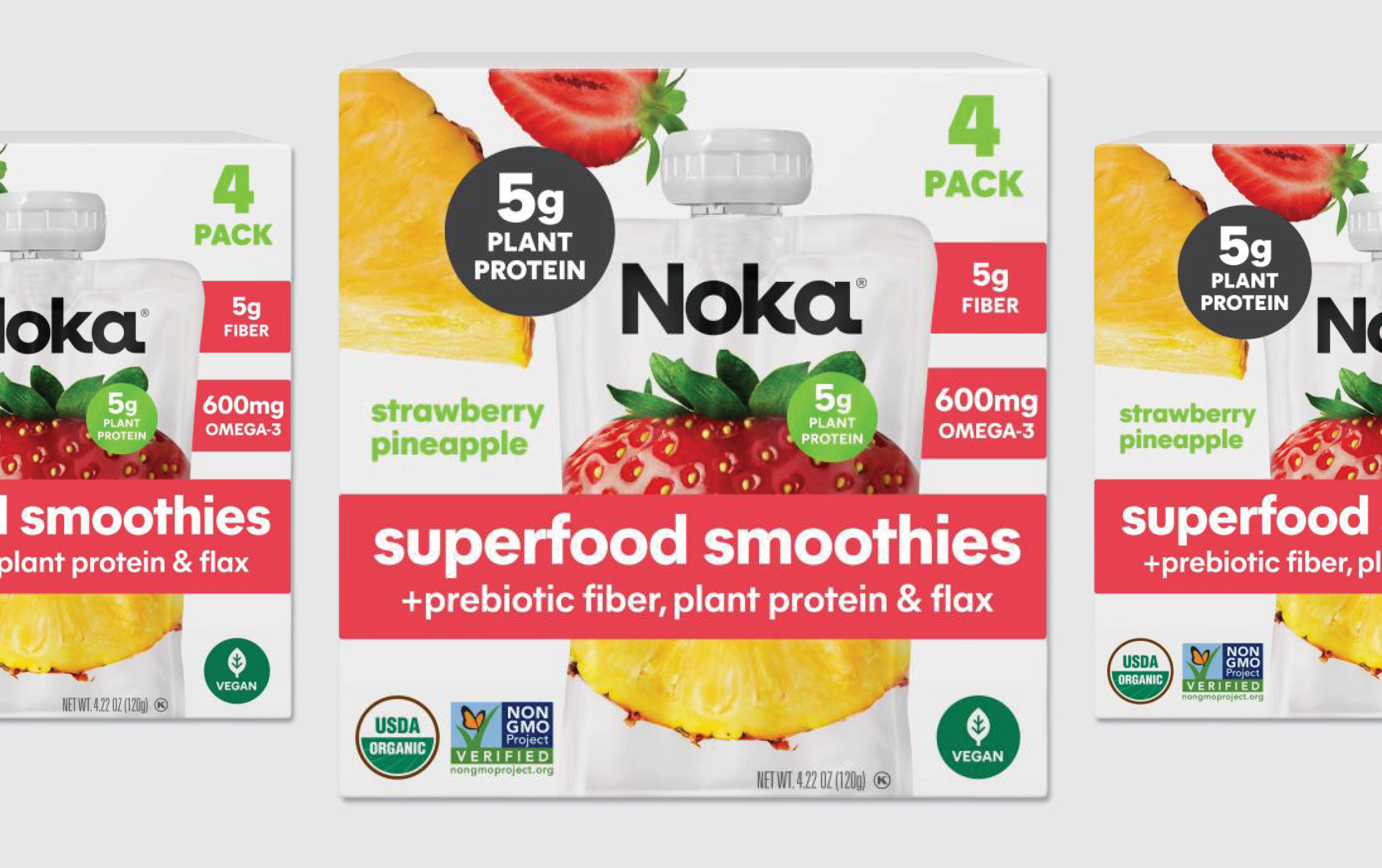 A box of Noka Superfood Smoothies, strawberry pineapple flavor, showing a smoothie pouch with fruit images. The box highlights 5g plant protein, 5g fiber, 600mg Omega-3, and vegan, USDA organic, and non-GMO icons.