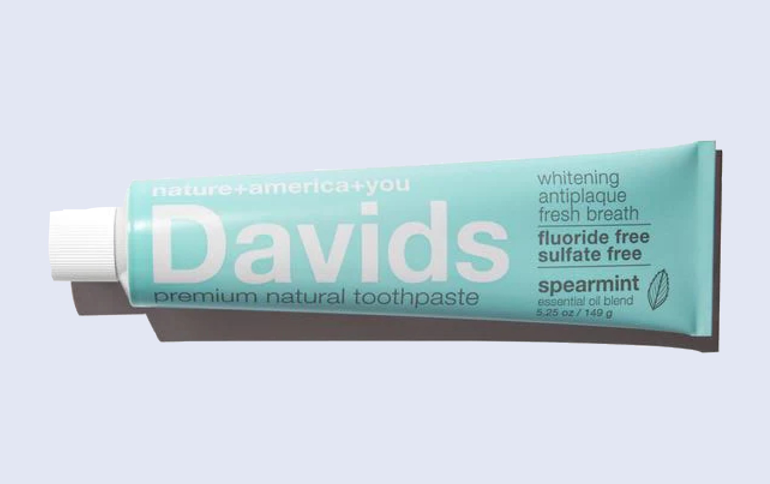 A teal tube of Davids premium natural toothpaste featuring text promoting whitening, antiplaque, fresh breath, fluoride free, and sulfate free, with spearmint flavor and a white cap.