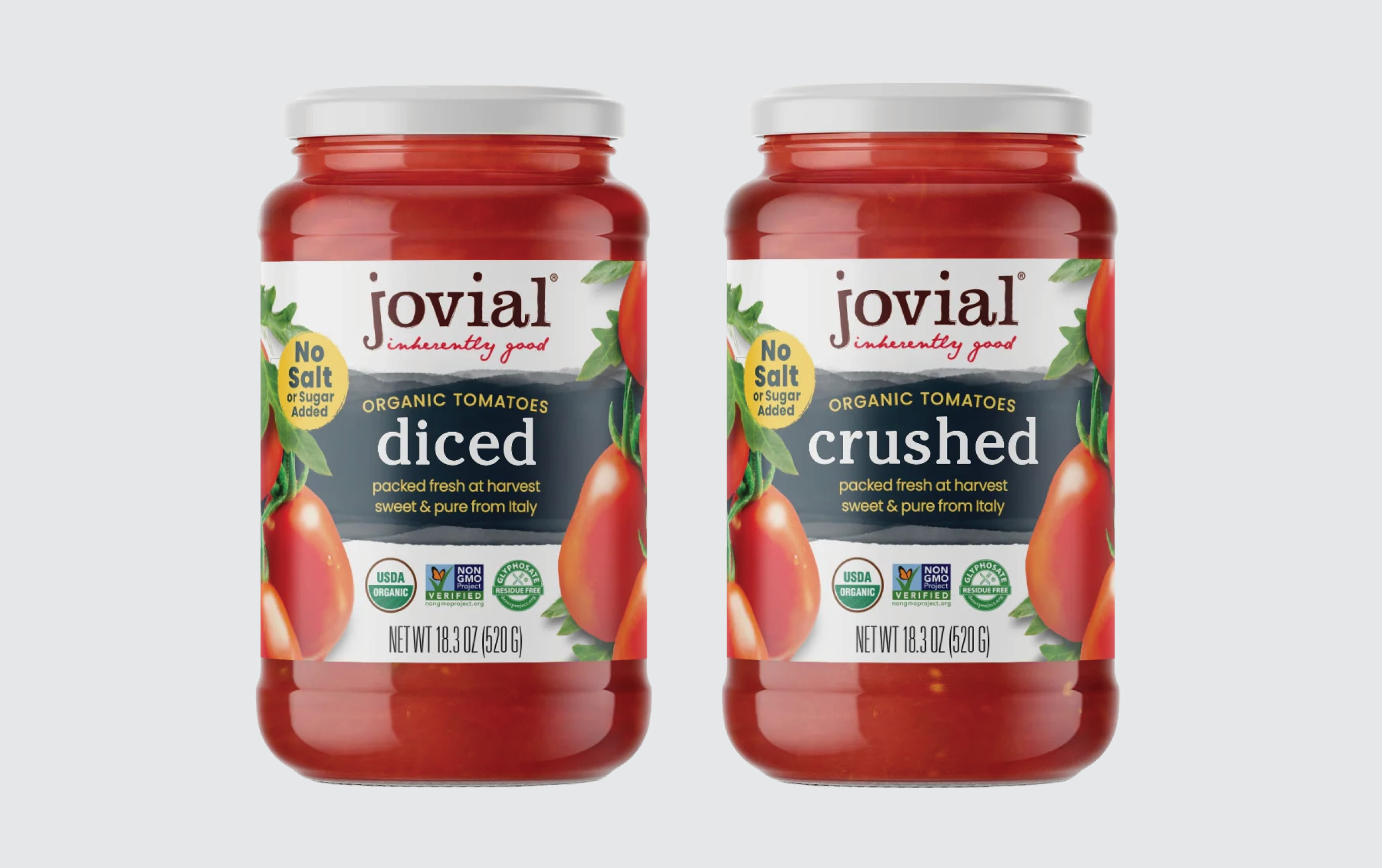 Two jars of Jovial organic tomatoes, one labeled diced and the other crushed. Both jars are 18.3 oz, display tomatoes on the label, and highlight No Salt or Sugar Added in yellow circles.